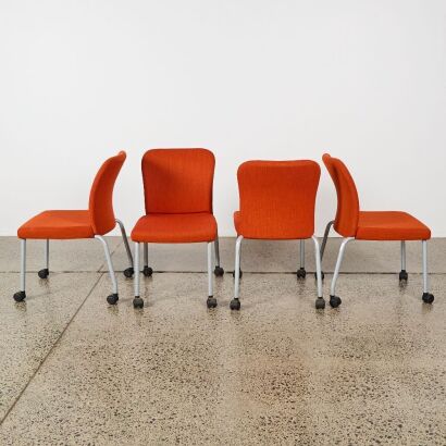 A Set of For Orange Upholstered Castor Chairs