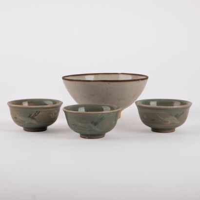 A Korean 13th to 14th Century Goryeo Dynasty White-glazed Small Bowl AND A Group of Three Celadon-glazed Small Cups