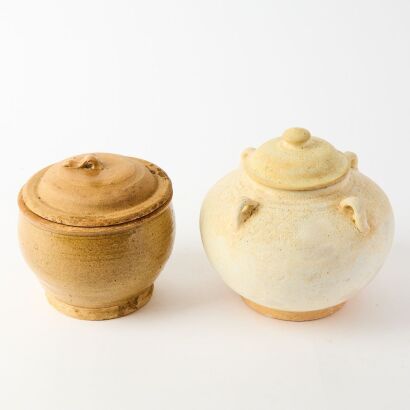 A South Asian White-glazed Four-Handled Covered Jar and a Blue-glazed Covered Jar