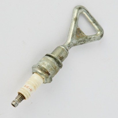 An Industrial Spark Plug Bottle Opener