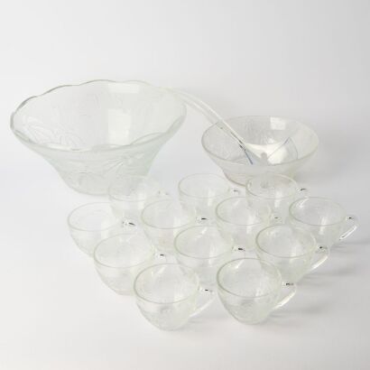A Set of Four Patterned Glass Cups and Two Glass Dishes