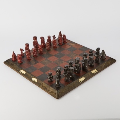 A Carved Ebony and Walnut Tribal Chess Set