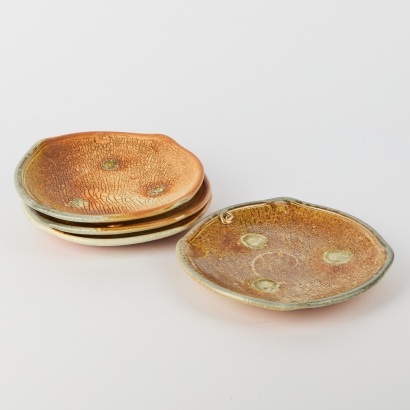 A Set of Four Duncan Shearer Salt Glazed Plates with a Crackle Effect Finish