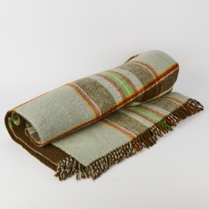 An Onehunga Pure Wool Travel Rug with Tiki Label