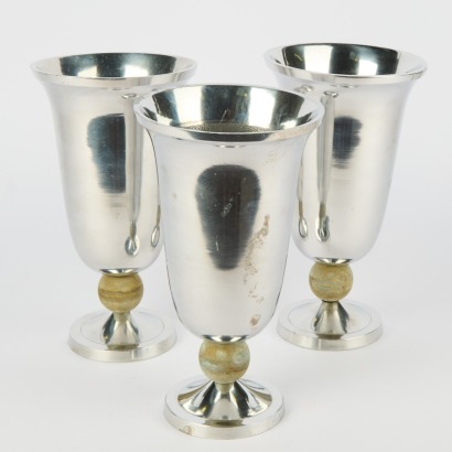 A Trio of Fluted Aluminium Vases