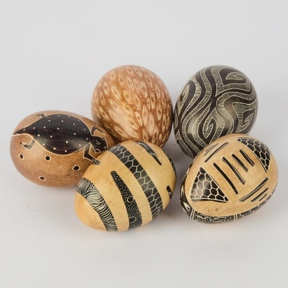 A Set of Six Hand Painted and Carved Soapstone Eggs