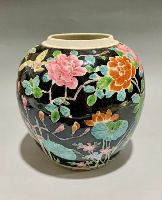 A Chinese Black Ground Famille Rose Jar