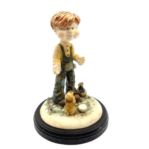 A Resin Ornament of a Boy (repaired)