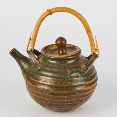 A Glazed Teapot with Cane Handle