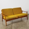 A Parker Teak Two Seater Lounge With Burnt Orange Upholstery