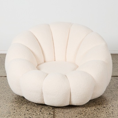 A Low Boucle Lotus Form Swivel Chair