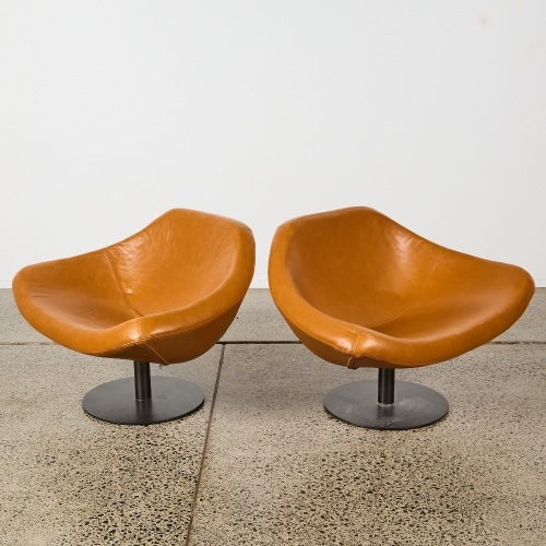 A Pair of Italian Leather Swivel Arm Chairs