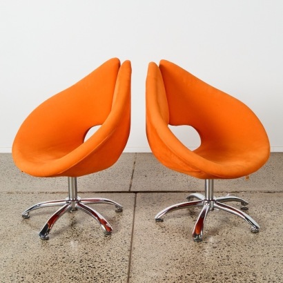 A Pair of Orange Velvet Manhattan Swivel Chairs