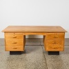 A Mid-Century Oak Twin-Pedestal Executive Desk