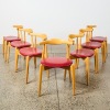 A Set of Seven Elbow Chairs