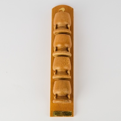 A Set of New Zealand RewaRewa Wooden Egg Cups on Wall Holder