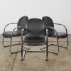 A Set of Three Leather Cantilever Chairs