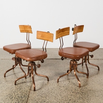A Set of Four Vintage Industrial Style Swivel Chairs