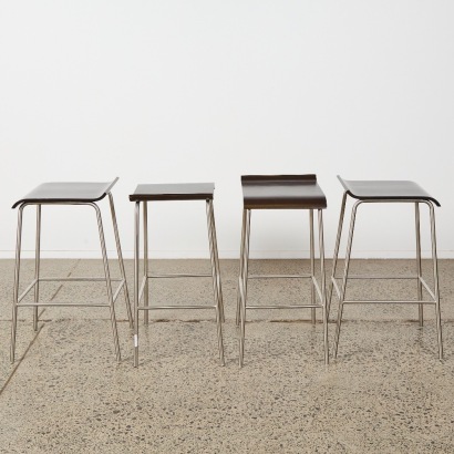 A Set of Four Stainless and Formed Ply Barstools