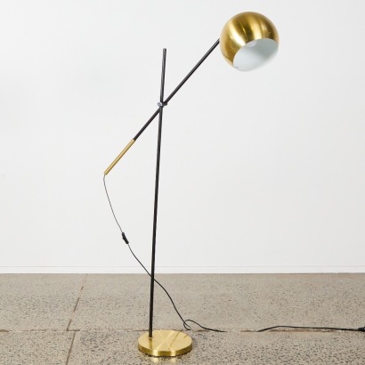 A Black and Gold Eyeball Style Lamp