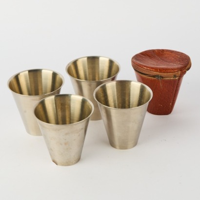 A Set of Vintage Travel Cups in a Pouch