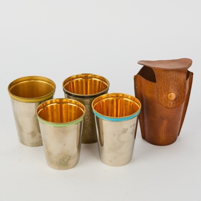 A Set of Vintage Travel Cups in a Pouch