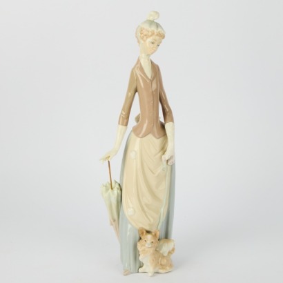 A Lladro Porcelain Figurine &ldquo;Lady With Umbrella & Dog&rdquo; #4761 Sculptured by Vicente Martinez