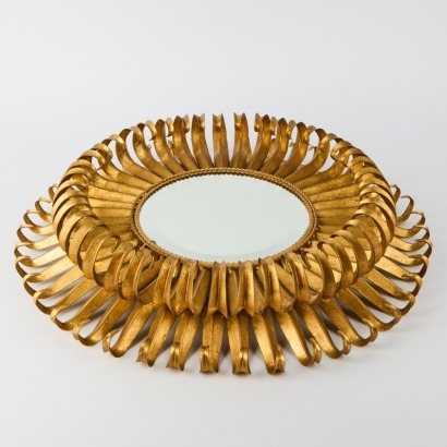 A Modernist Gold Sunburst Pattern Mirror with Central Beveled Design