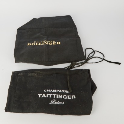 A pair of Sommeliers Aprons. One is Tattanger the other Bollinger