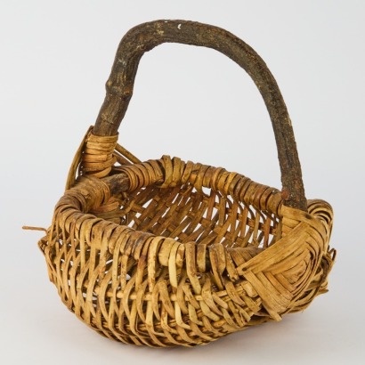 A Vintage Handwoven Gathering Basket with Branch Handle