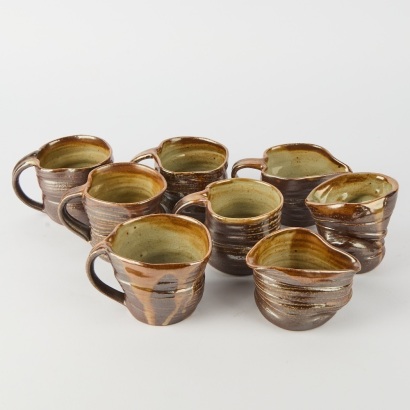 A Set of Seven New Zealand Studio Pottery "Crushed" Cups Jugs and Bowl