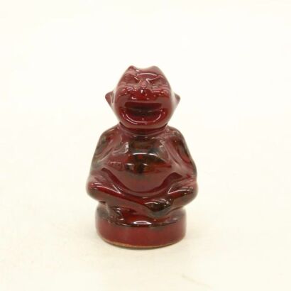 A Chinese 20th Century Resin Carved Red Laughter Buddha