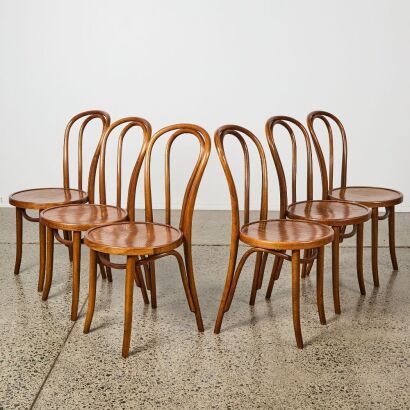 A Set of Six Walnut Cintesi Twist Bentwood Chairs
