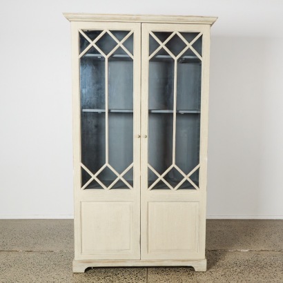An Alton Cabinet with an Antique White Sealed Finish by Dovetail Furniture