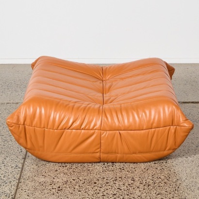 A Tan Togo Style Ottoman