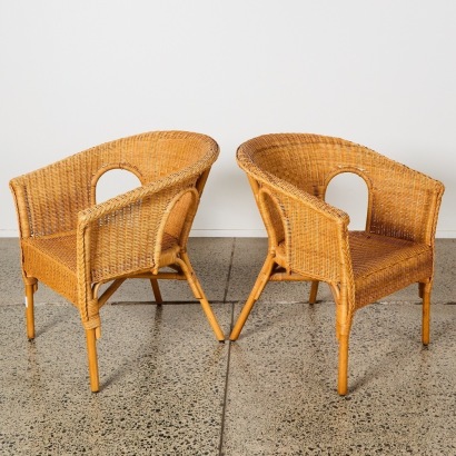 A Paid Of Rattan Chairs