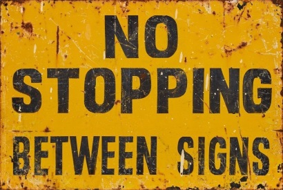 A Vintage Hand Painted 'No Stopping' Metal Sign