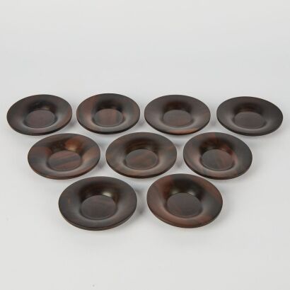 A Group of Nine Chinese Ebony Tea Saucers
