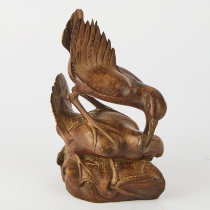 A Southeast Asian Art Deco Wood Carving of Herons Fighting over a Fish