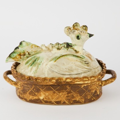A Studio Pottery Hen in a Basket