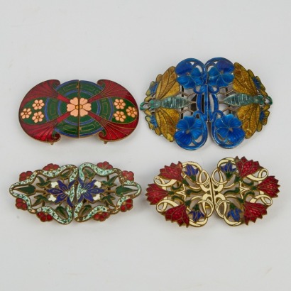 A Set of Four Art Noveau Enamel on Brass Belt Buckles