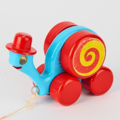 A Vintage New Zealand Made Painted Wooden Toy Of A Snail On Wheels c.1960's