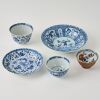 A Group of Five Chinese Kangxi Period Blue and White &lsquo;Fish and Figural&rsquo; Small Cups and Saucers