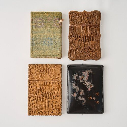 A Set of Four Chinese Qing Dynasty Carved Wood and Black Lacquer Card Cases