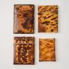 A Set of Four Decorative Tortoiseshell Card Cases