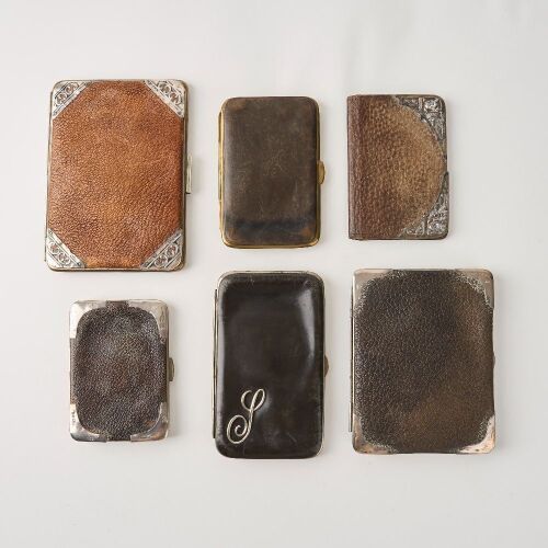 A Set of Six Decorative Leather Wallet Cases