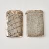 A Set of Two Decorated Silver Card Cases