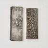 A Set of Two Decorated Silver Card Cases