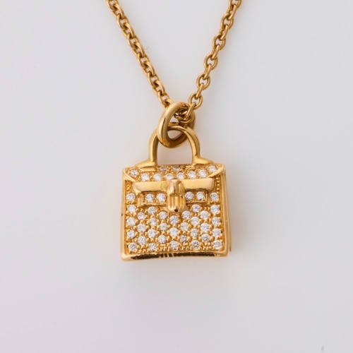 Herm&egrave;s, 18ct Yellow Gold, Amulettes 0.21ct Diamond Kelly Pendant Necklace with Box