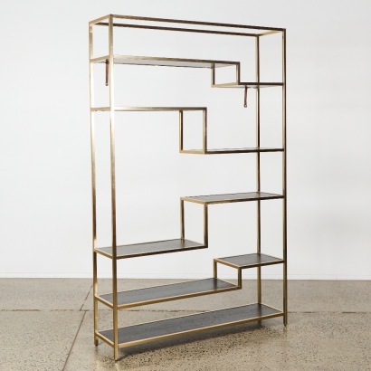 An Asymmetrical Shelving Unit in Brass & Black